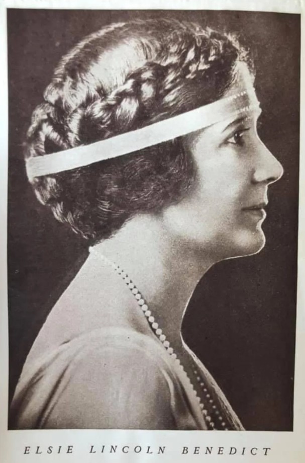 Supplied historical profile portrait captioned Elsie Lincoln Benedict, wearing a headband and necklace